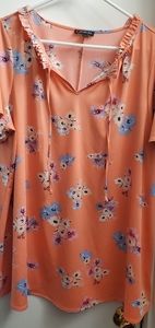Shirt sleeve Lane Bryant blouse. Peach color with pastel flowers